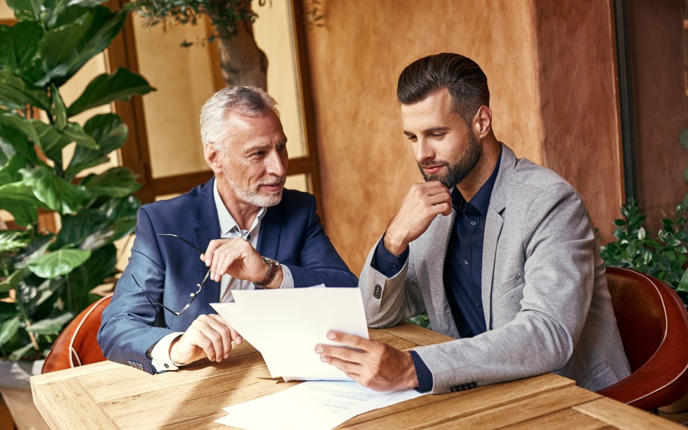 Two men talking about Succession Planning