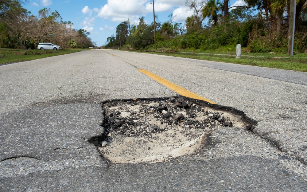 Broken road; claim against the local council