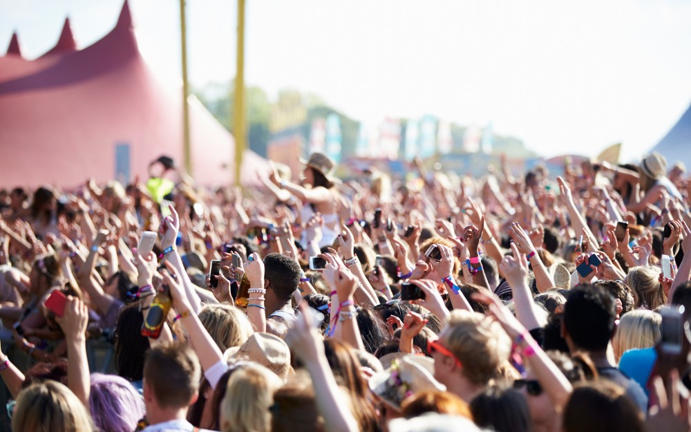 Crowd gathered in a concert, knowing the risk of public event injuries