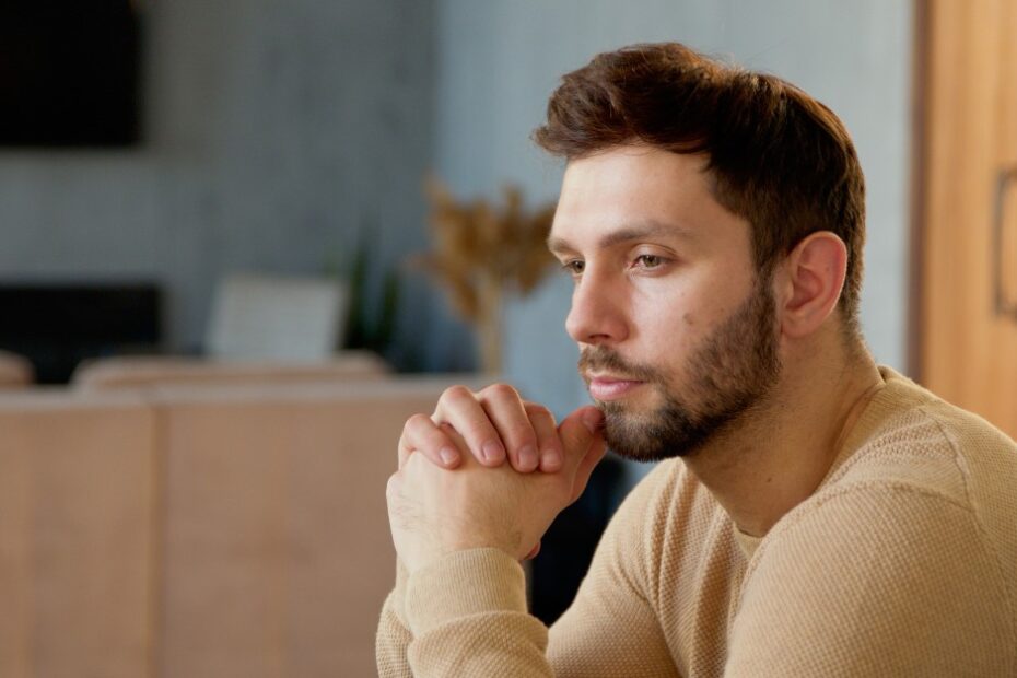 Pensive man thinking about probate caveats: estate dispute