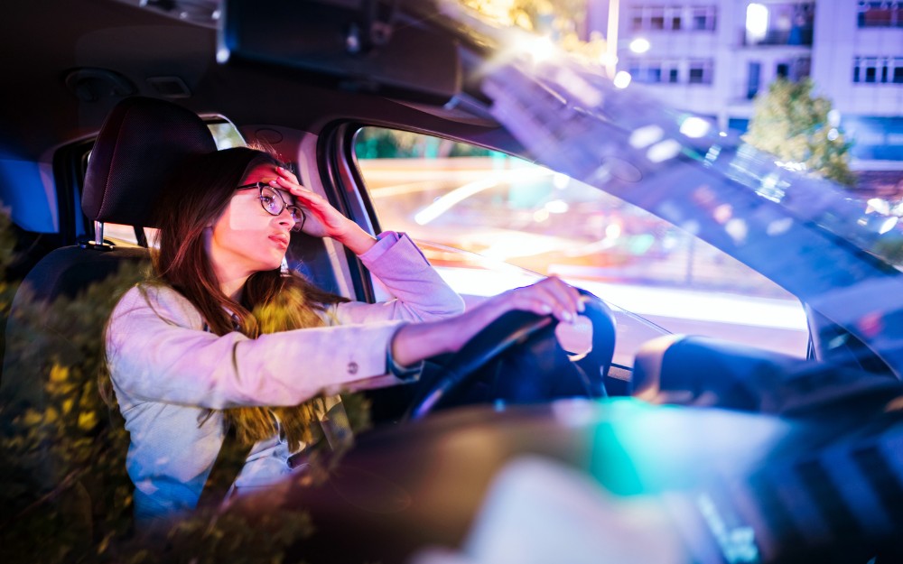 woman driving at night, at risk of Fatigue-Related Road Accidents