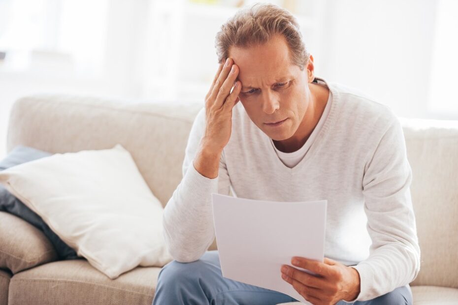 Man reading a letter about his rejected tpd claim