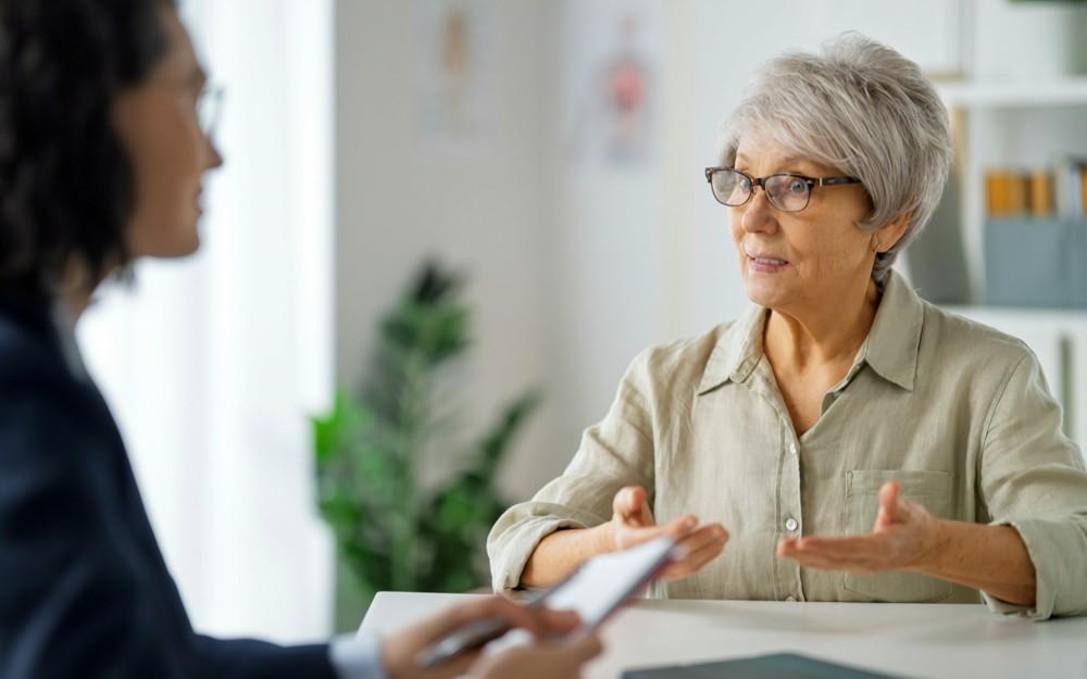 Elderly woman talking to an estate planning lawyer about an Enduring Power of Attorney in Queensland