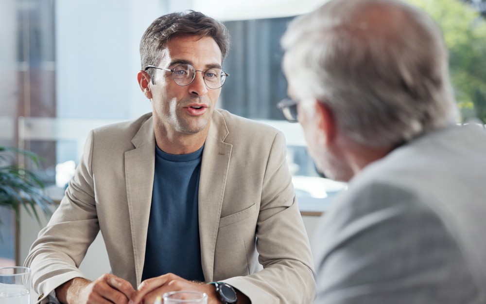 Middle-aged man talking to an estate planning lawyer about how to remove/revoke a power of attorney in QLD